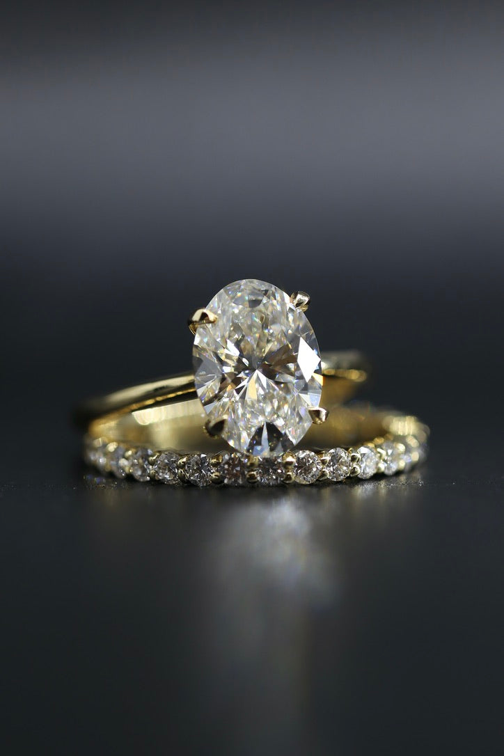 3 carat oval lab grown diamond ring GIA certified yellow gold with wedding band
